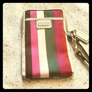COACH Legacy striped wristlet
